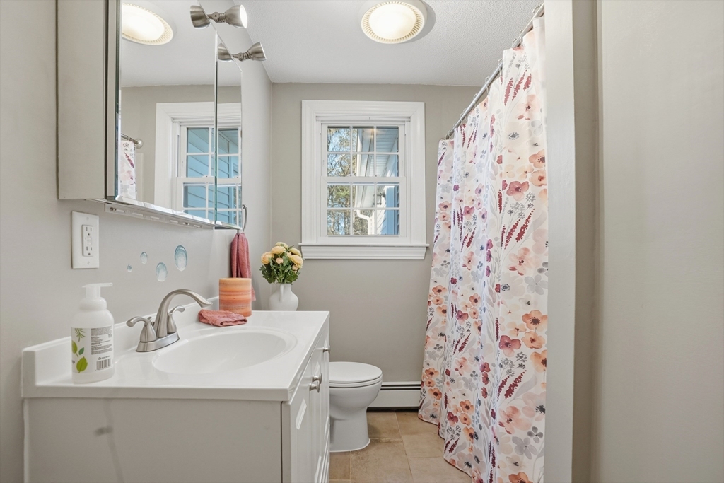 492 Elm Street Framingham, MA 01701 - Photo 13 of 27 a bathroom with a sink toilet and shower