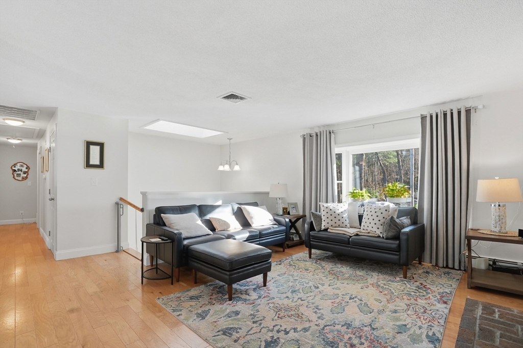 492 Elm Street Framingham, MA 01701 - Photo 2 of 27 a living room with furniture and a window