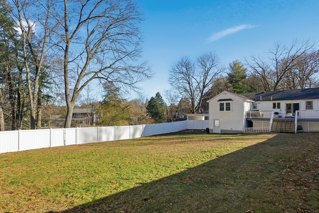 492 Elm Street Framingham, MA 01701 - Photo 22 of 27 a view of a house with pool and trees in the background