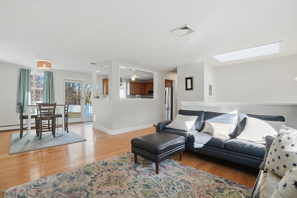 492 Elm Street Framingham, MA 01701 - Photo 3 of 27 a living room with furniture and a wooden floor