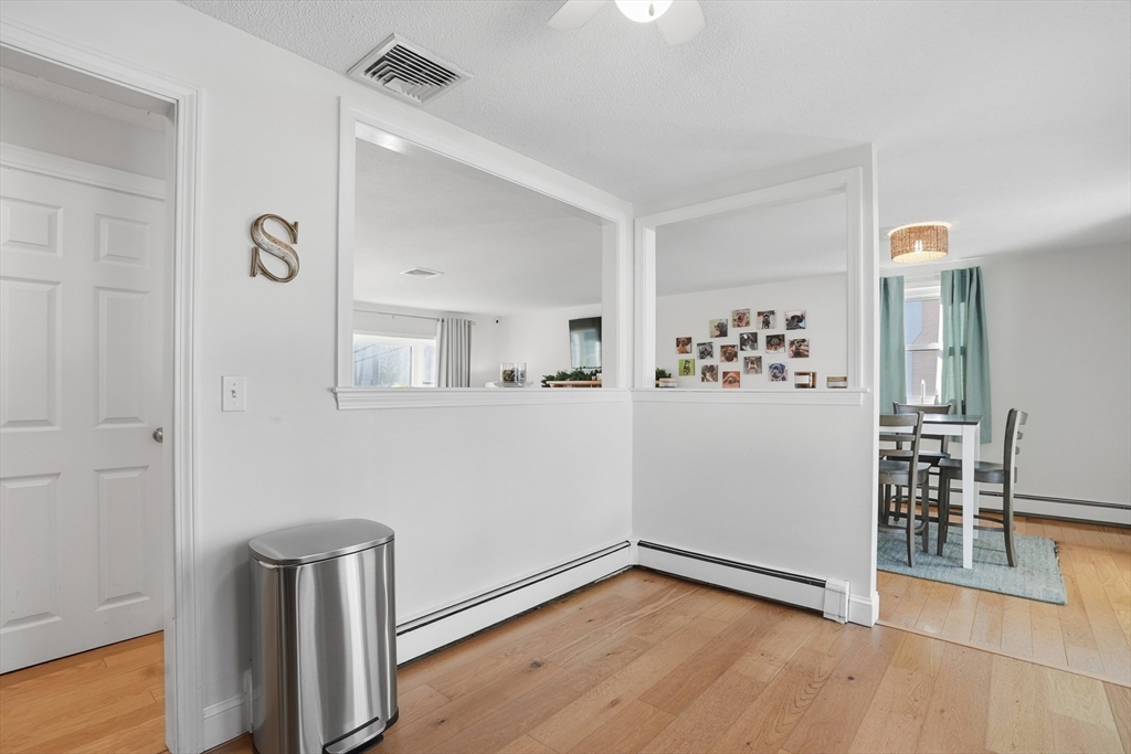 492 Elm Street Framingham, MA 01701 - Photo 6 of 27 wooden floor in an empty room