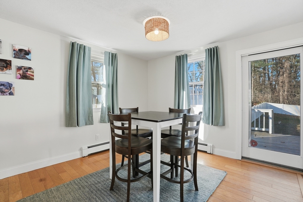 492 Elm Street Framingham, MA 01701 - Photo 7 of 27 a view of a dining room with furniture and wooden floor