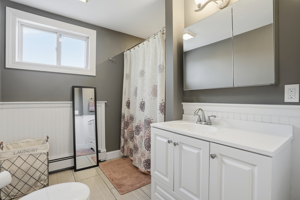 492 Elm Street Framingham, MA 01701 - Photo 10 of 27 a bathroom with a sink toilet and shower