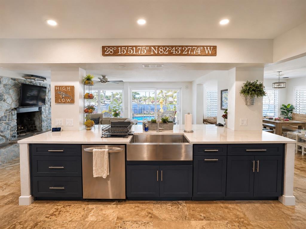 5431 Foley Square New Port Richey, FL 34652 - Photo 14 of 39 a kitchen with stainless steel appliances granite countertop a sink and cabinets
