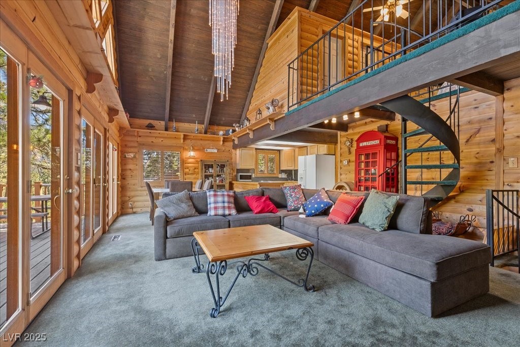 370 Alpine Way Mount Charleston, NV 89124 - Photo 5 of 79 Living room features soaring vaulted ceilings, a custom chandelier + views of Mummy Mountain.