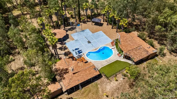 an aerial view of a house with outdoor space