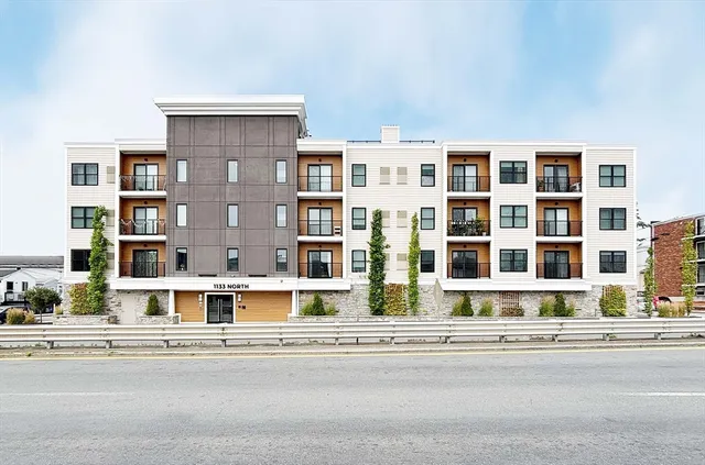 a front view of a building with a street