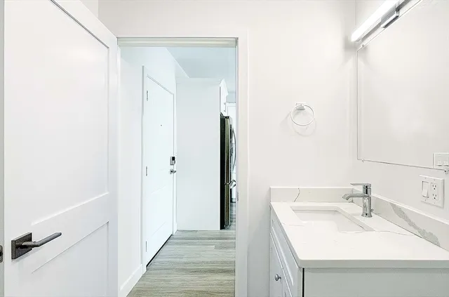 a bathroom with a sink and a mirror