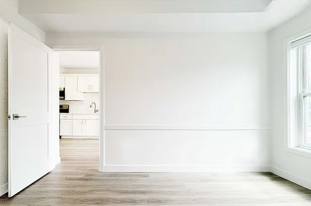 a view of walk in closet with empty racks
