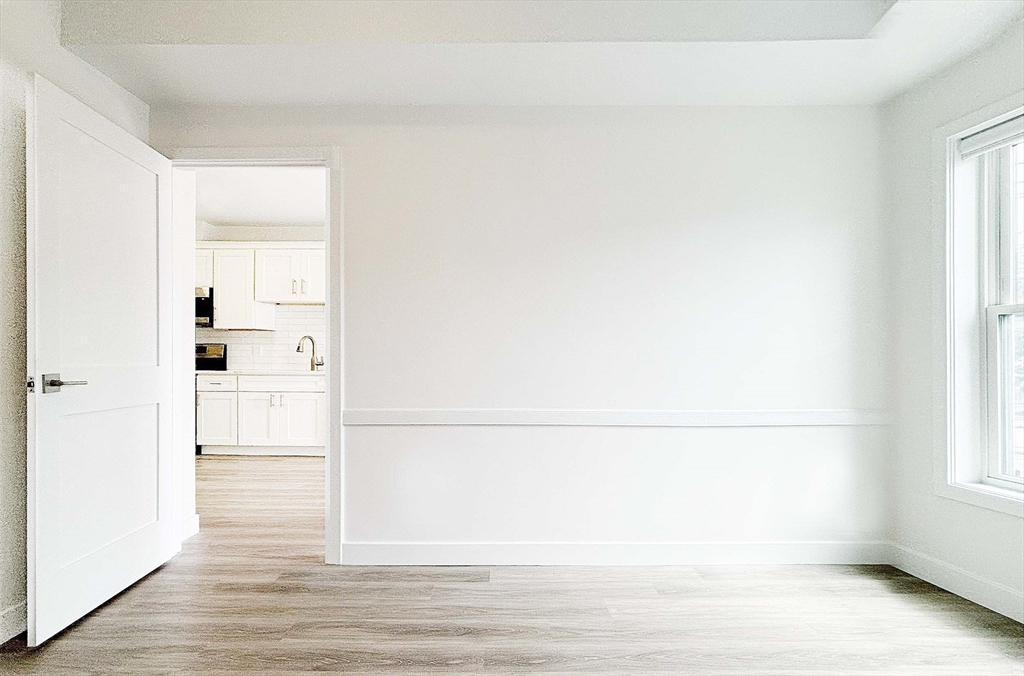 1133 North Shore Road, Unit 205 Revere, MA 02151 - Photo 9 of 16 a view of walk in closet with empty racks