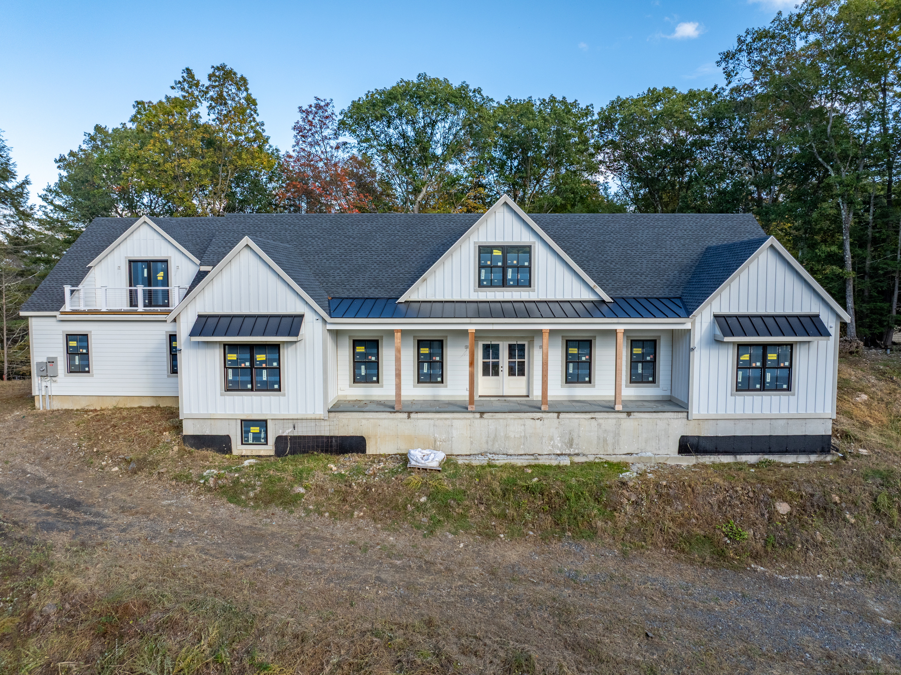 255 Great Plain Road Danbury, CT 06811 - Photo 19 of 20 a front view of a house with a garden