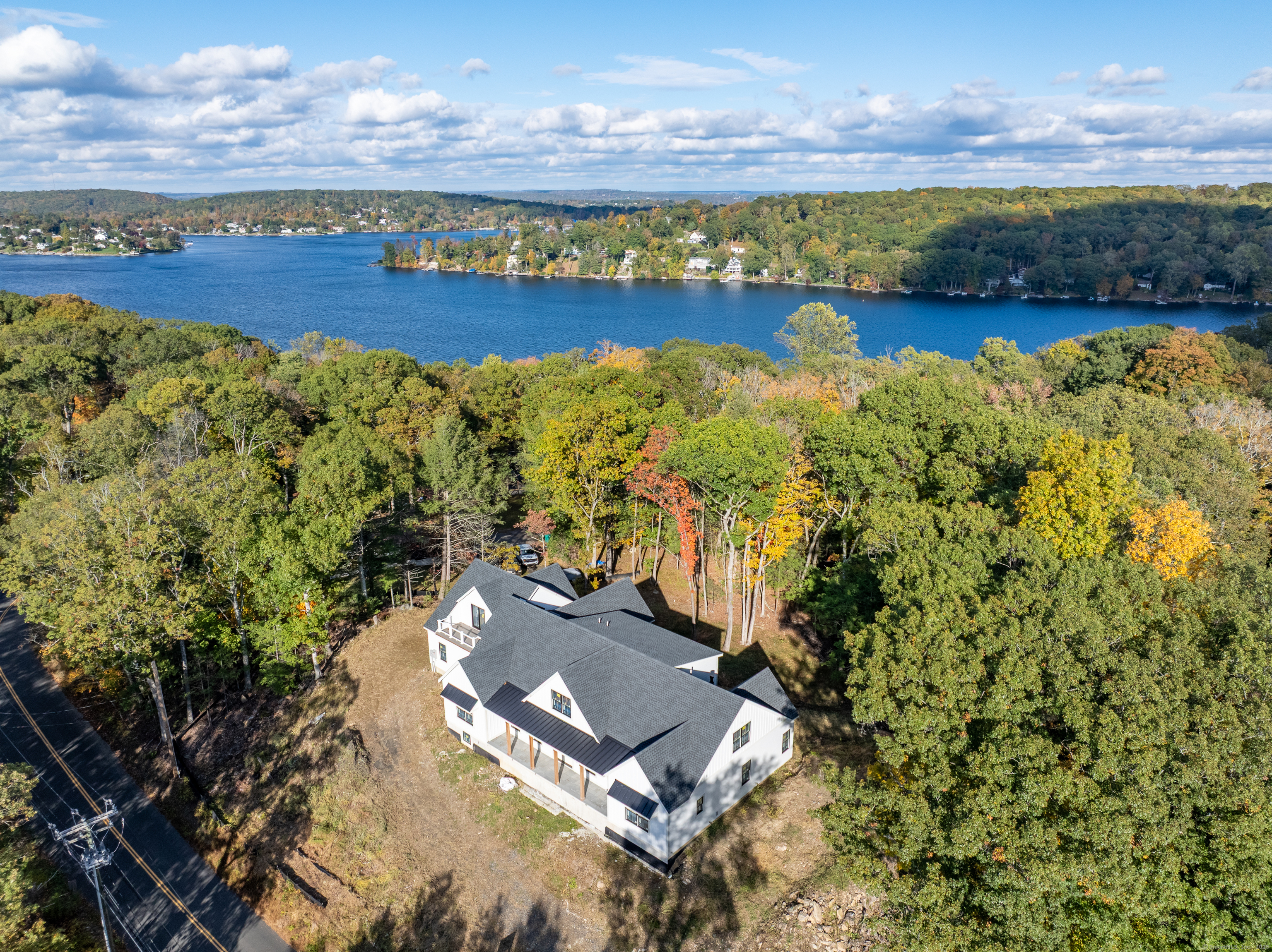 255 Great Plain Road Danbury, CT 06811 - Photo 5 of 20 a view of a lake with a mountain in the background