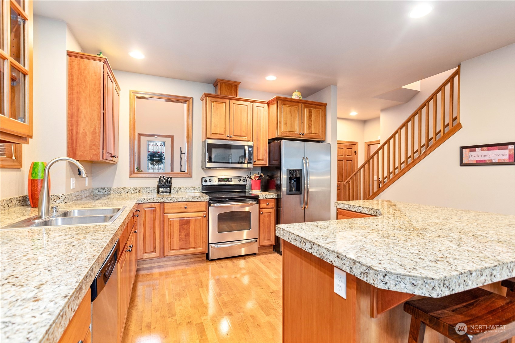 8864 Depot Road, Unit B Lynden, WA 98264 - Photo 17 of 39 a kitchen with stainless steel appliances granite countertop a sink counter space and a window