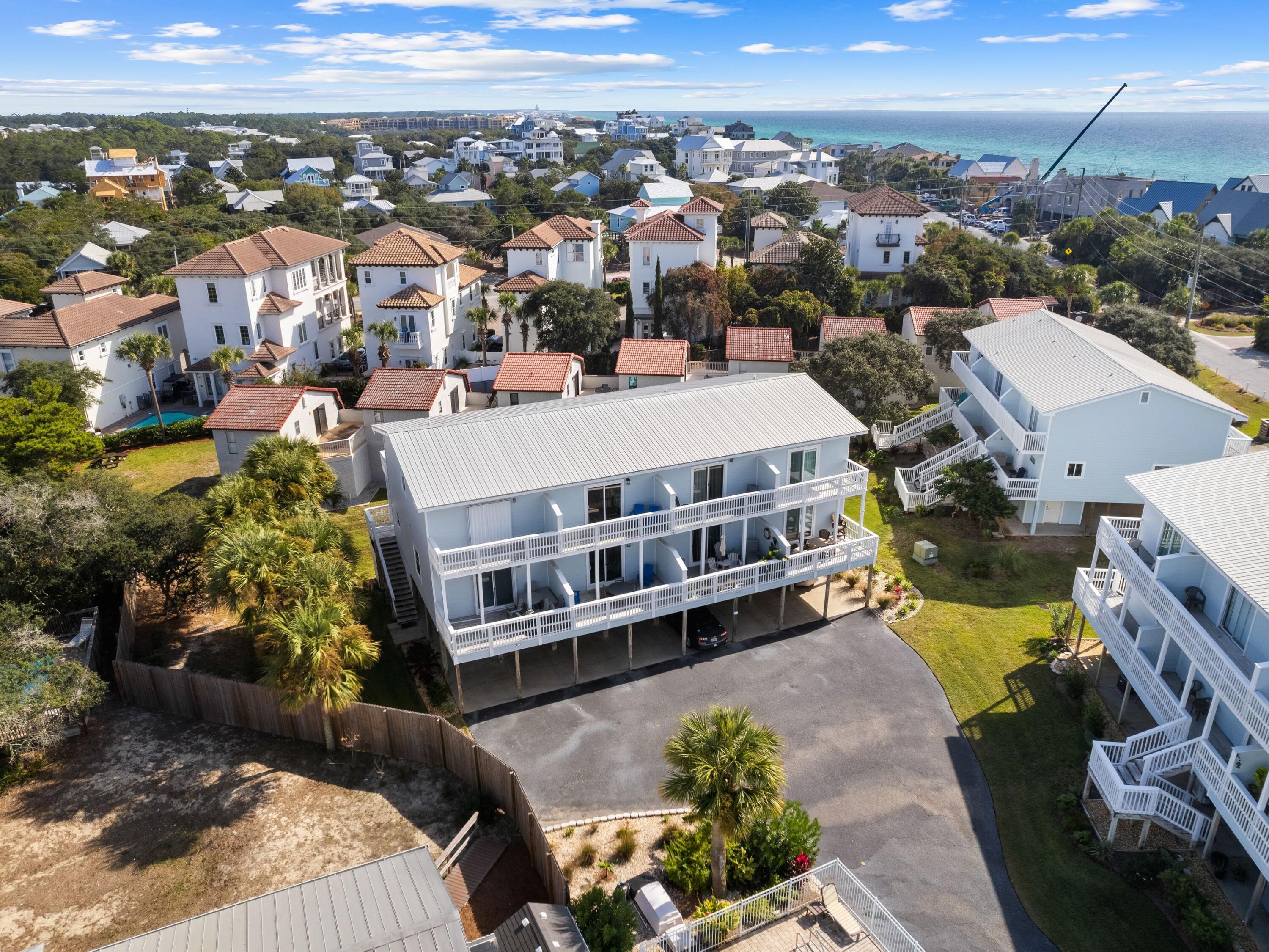 209 Blue Mountain Road, Unit 302 Santa Rosa Beach, FL 32459 - Photo 1 of 40 a view of a city that has tall buildings