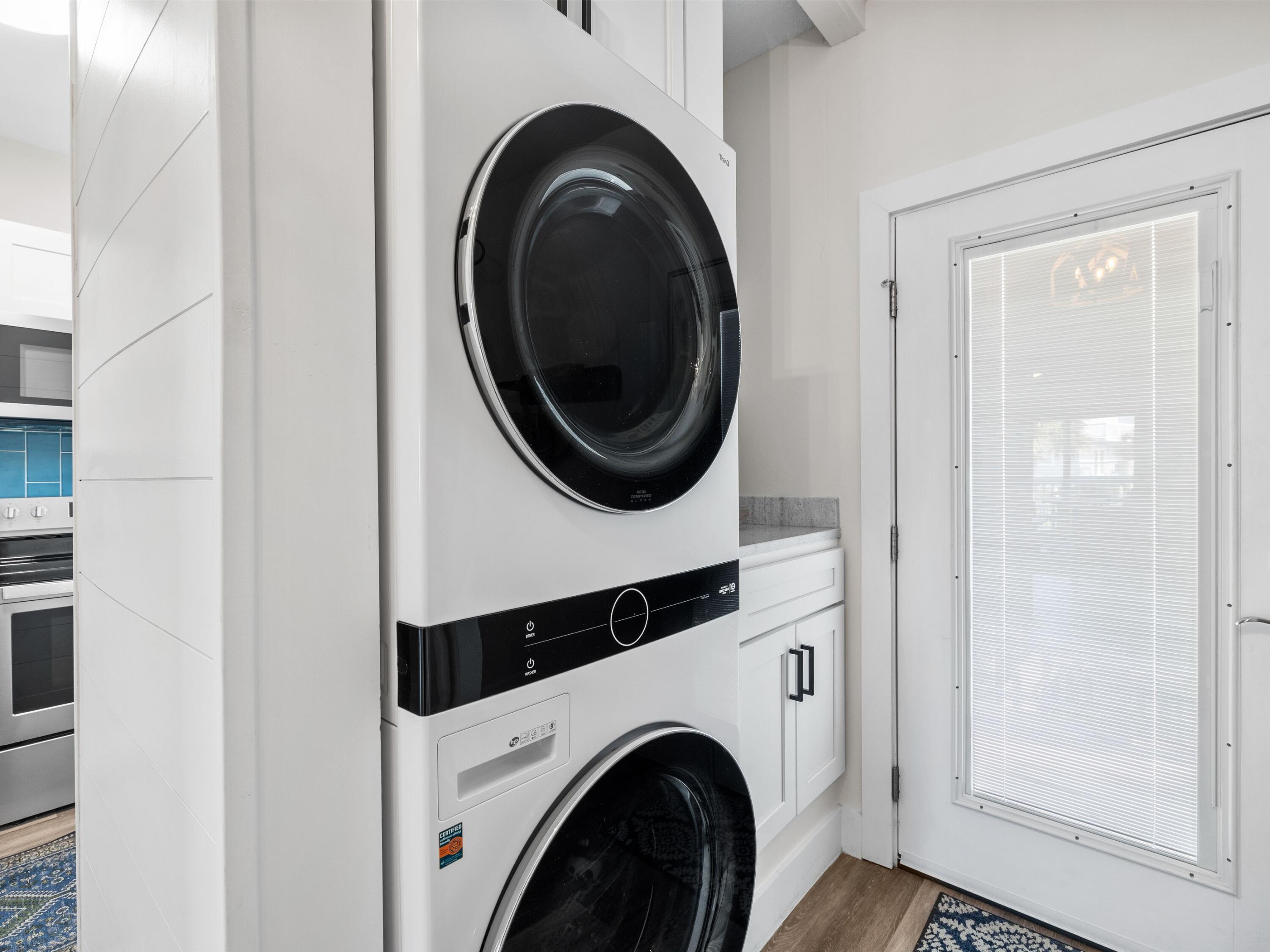 209 Blue Mountain Road, Unit 302 Santa Rosa Beach, FL 32459 - Photo 20 of 40 a utility room with dryer and washer