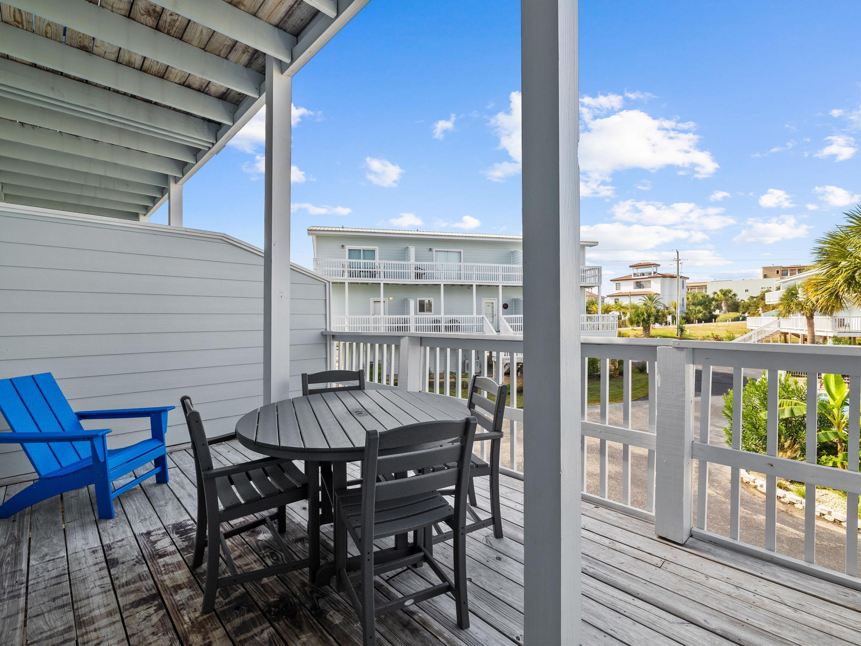 209 Blue Mountain Road, Unit 302 Santa Rosa Beach, FL 32459 - Photo 21 of 40 a view of a chairs and table in the balcony