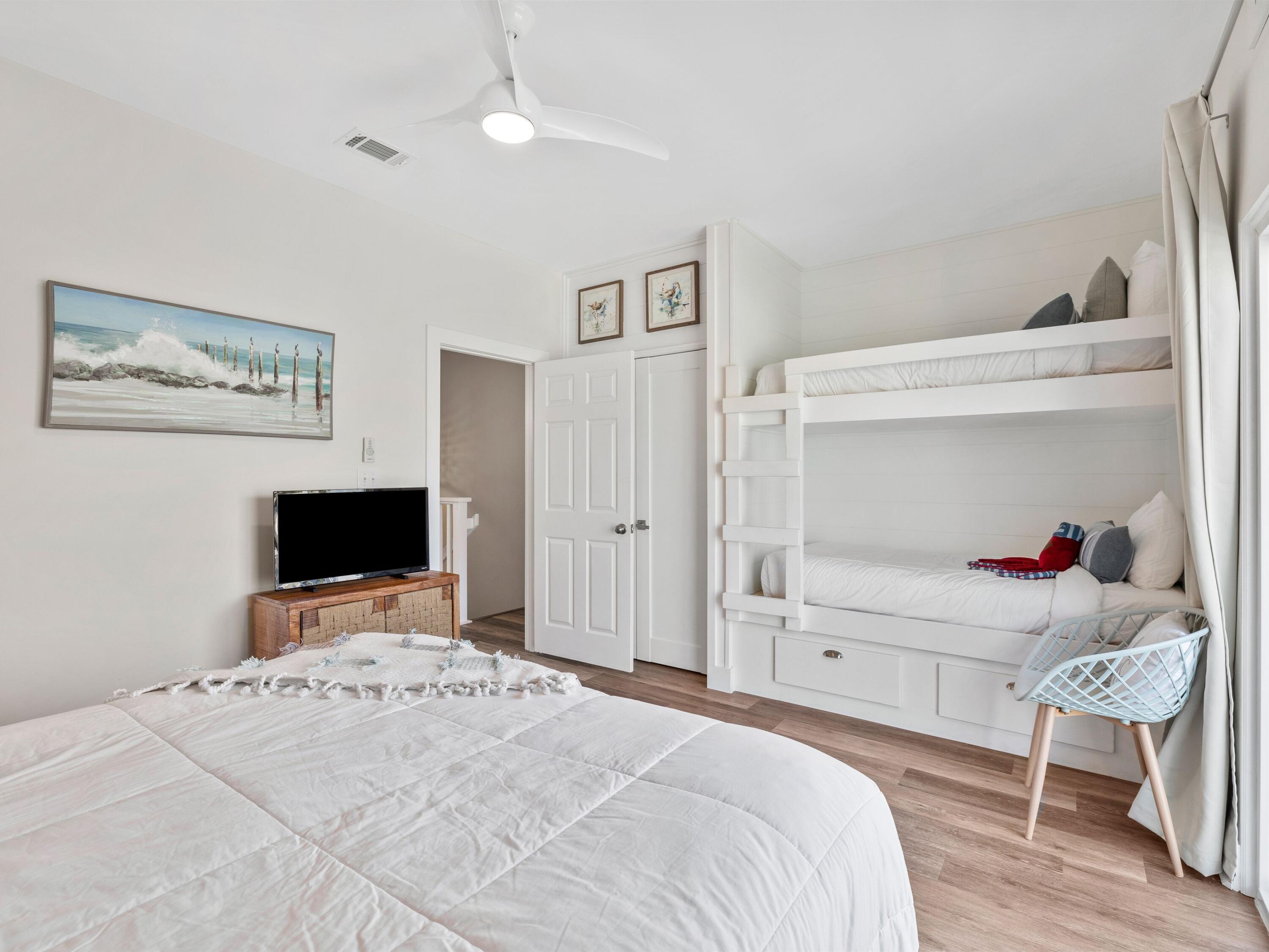 209 Blue Mountain Road, Unit 302 Santa Rosa Beach, FL 32459 - Photo 25 of 40 a bedroom with a bed and a flat screen tv