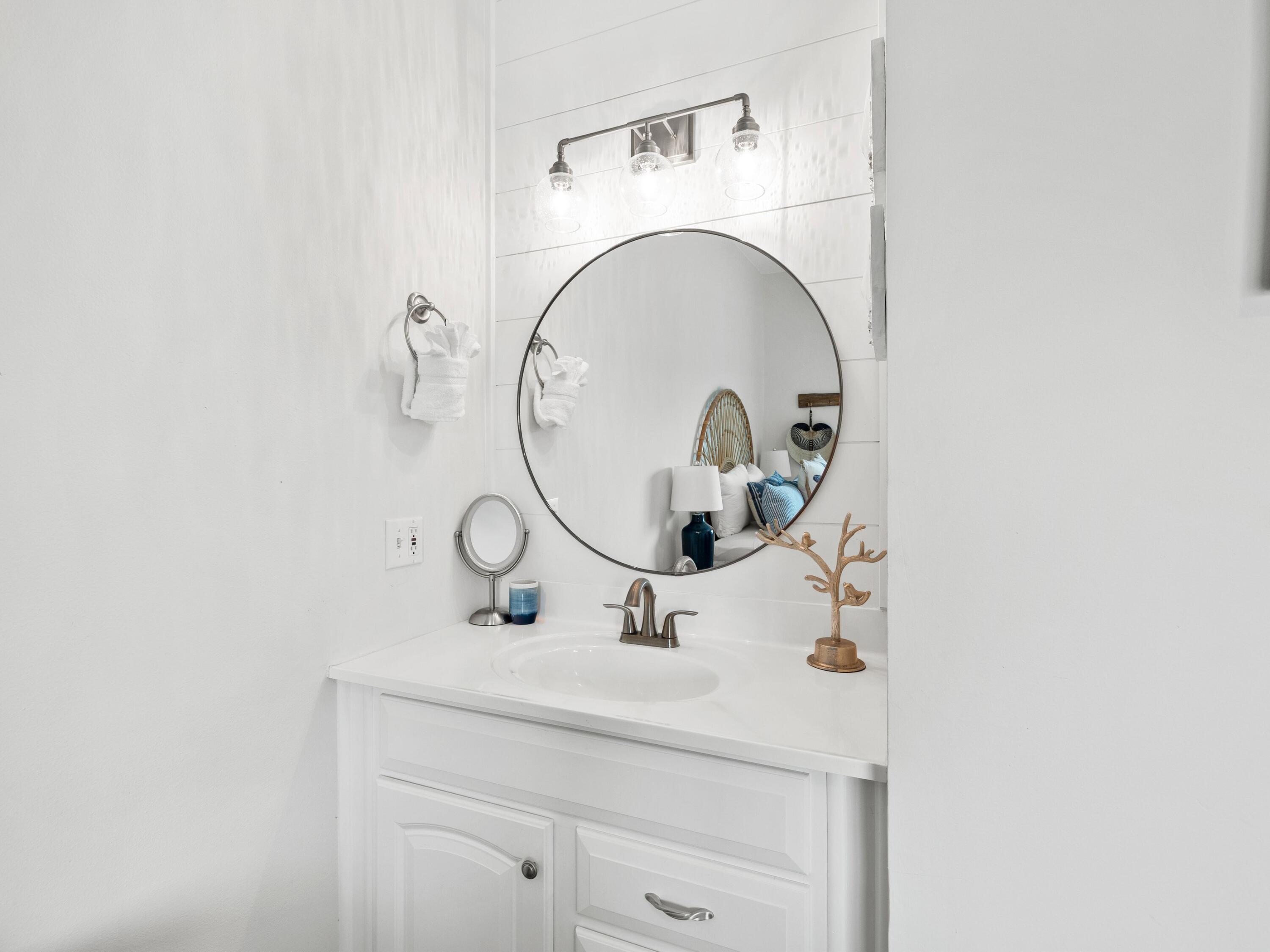 209 Blue Mountain Road, Unit 302 Santa Rosa Beach, FL 32459 - Photo 28 of 40 a bathroom with a sink and a mirror