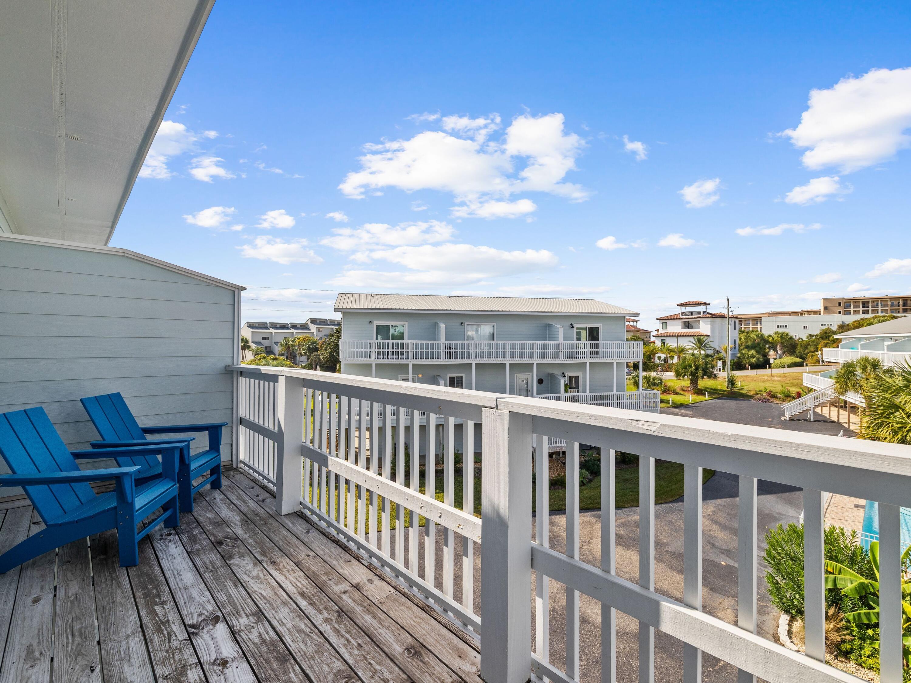 209 Blue Mountain Road, Unit 302 Santa Rosa Beach, FL 32459 - Photo 29 of 40 a view of a balcony with chairs