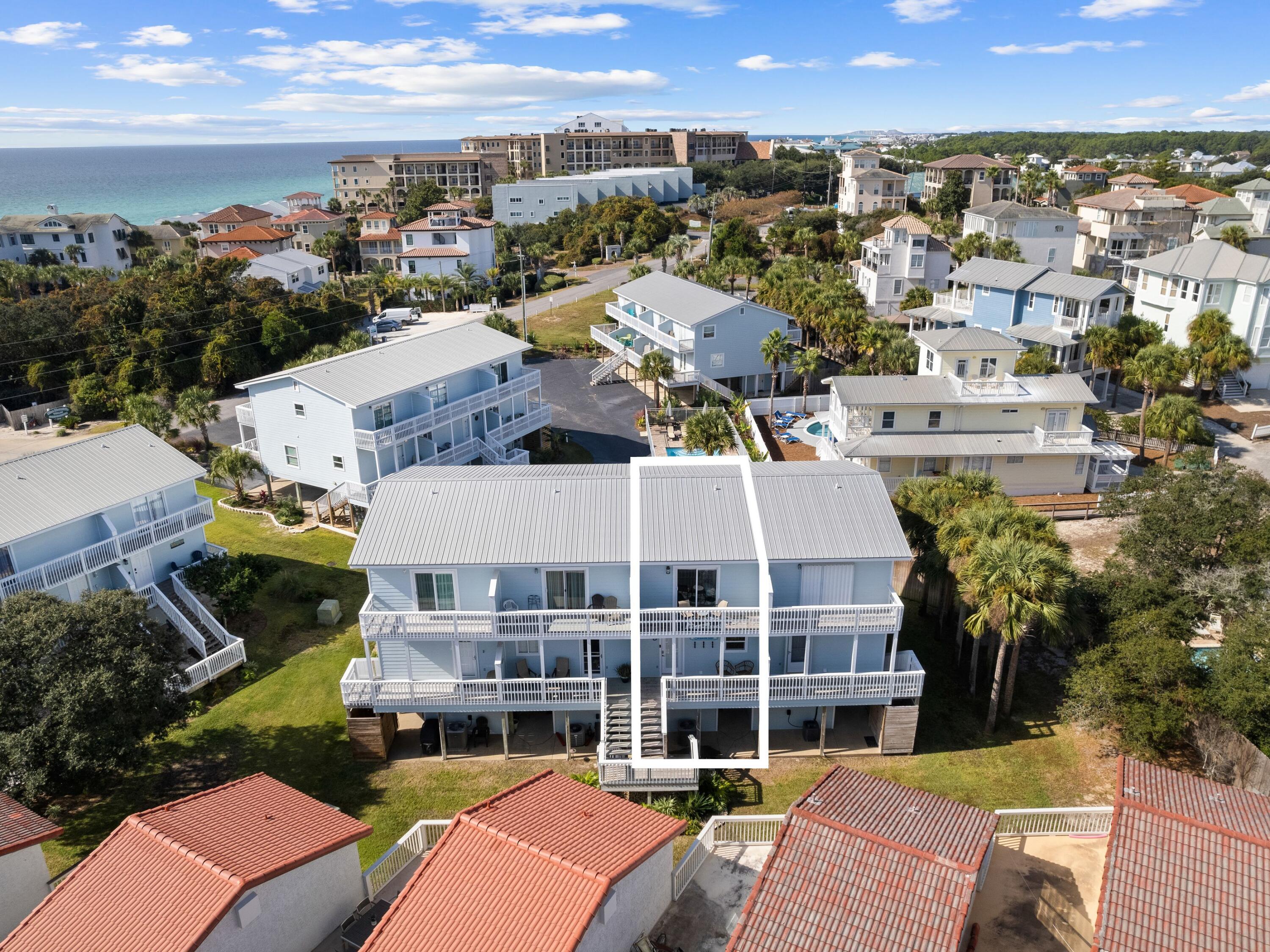 209 Blue Mountain Road, Unit 302 Santa Rosa Beach, FL 32459 - Photo 3 of 40 a view of a city that has tall buildings