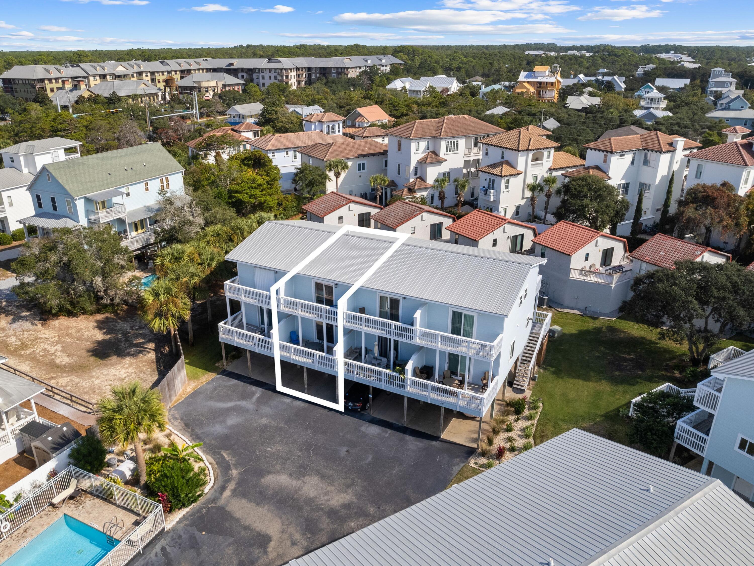 209 Blue Mountain Road, Unit 302 Santa Rosa Beach, FL 32459 - Photo 38 of 40 a view of a house with a yard