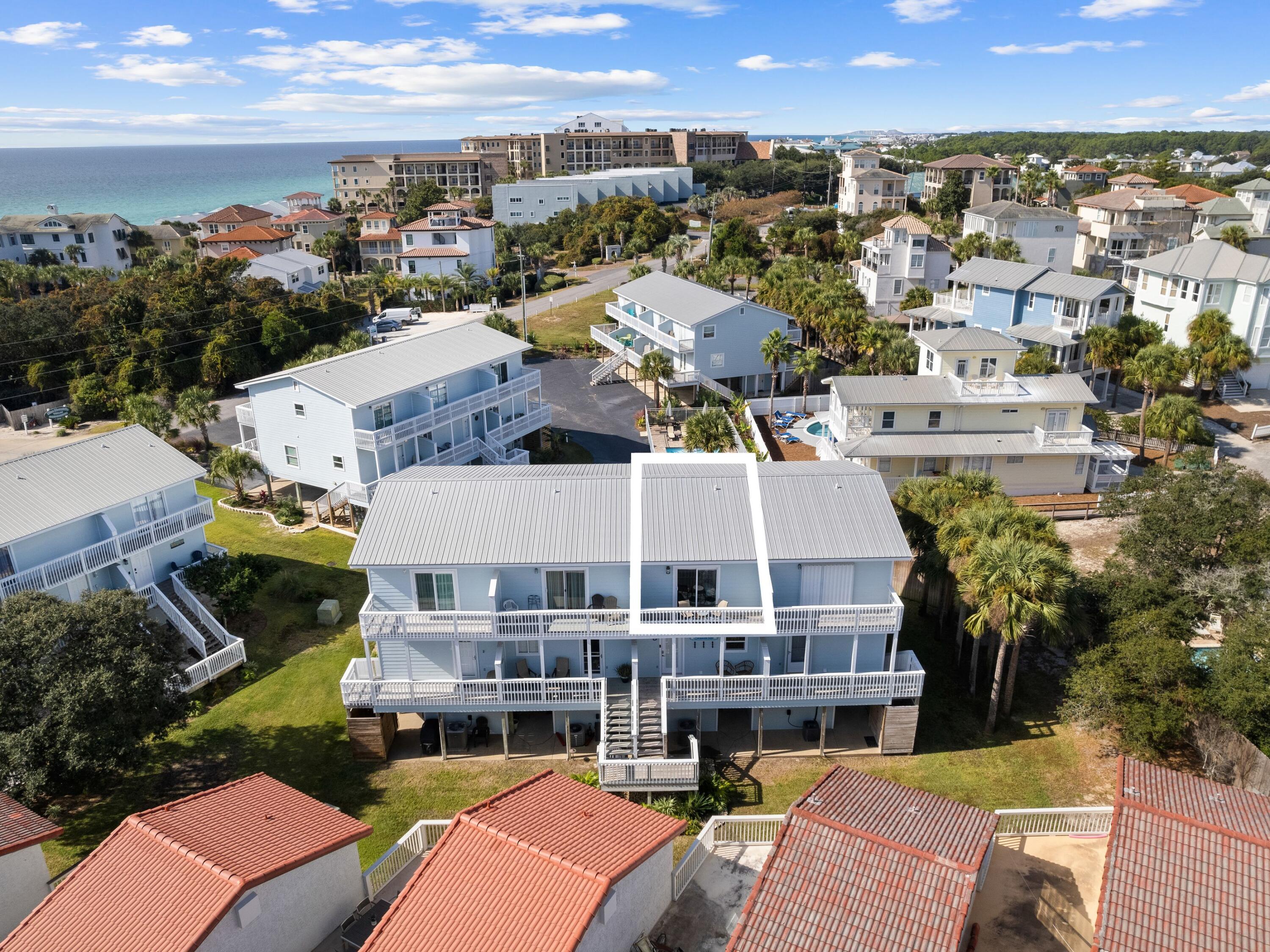209 Blue Mountain Road, Unit 302 Santa Rosa Beach, FL 32459 - Photo 39 of 40 an aerial view of a house with a swimming pool outdoor seating and yard