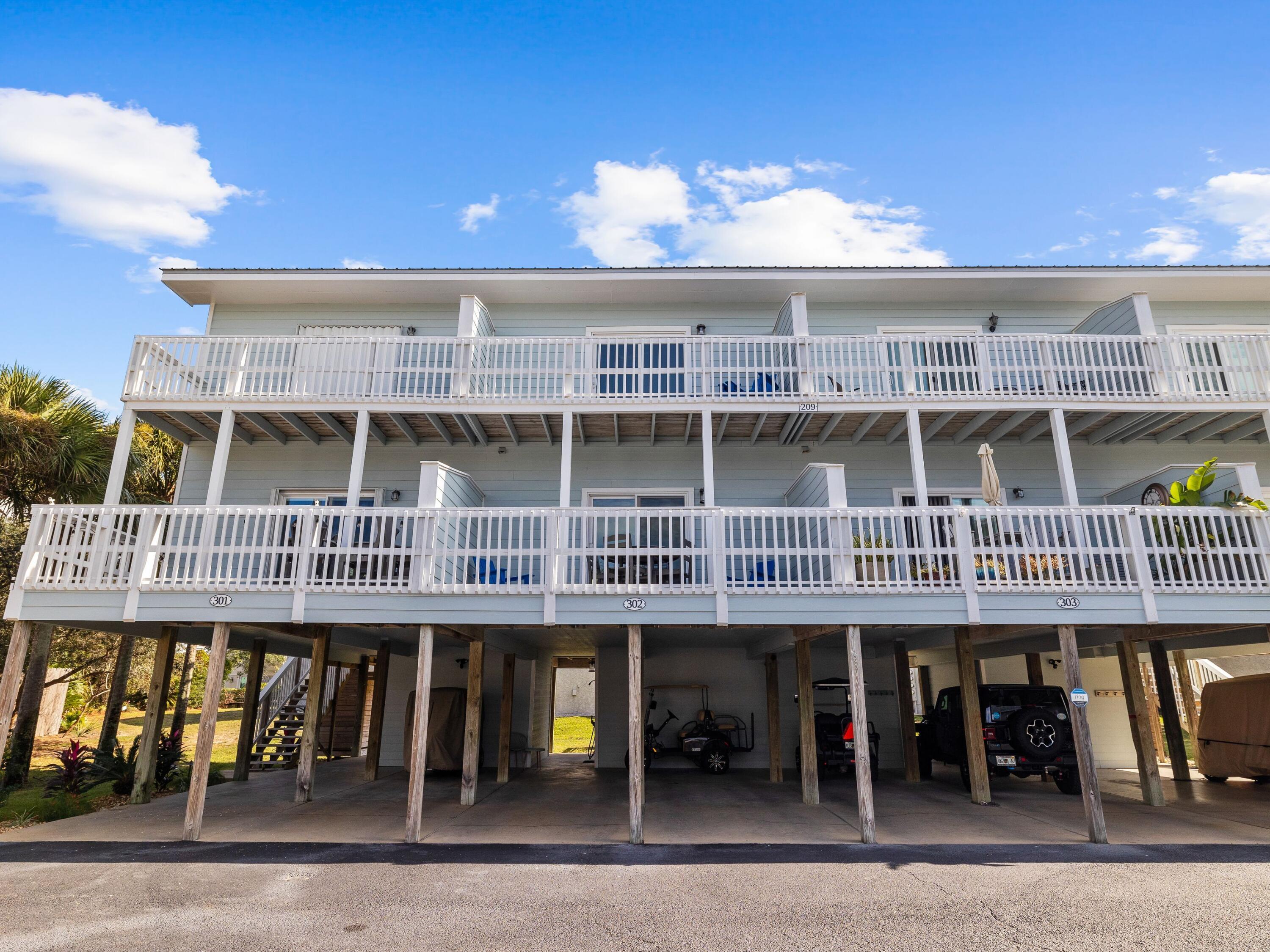 209 Blue Mountain Road, Unit 302 Santa Rosa Beach, FL 32459 - Photo 5 of 40 a front view of a building and a terrace view