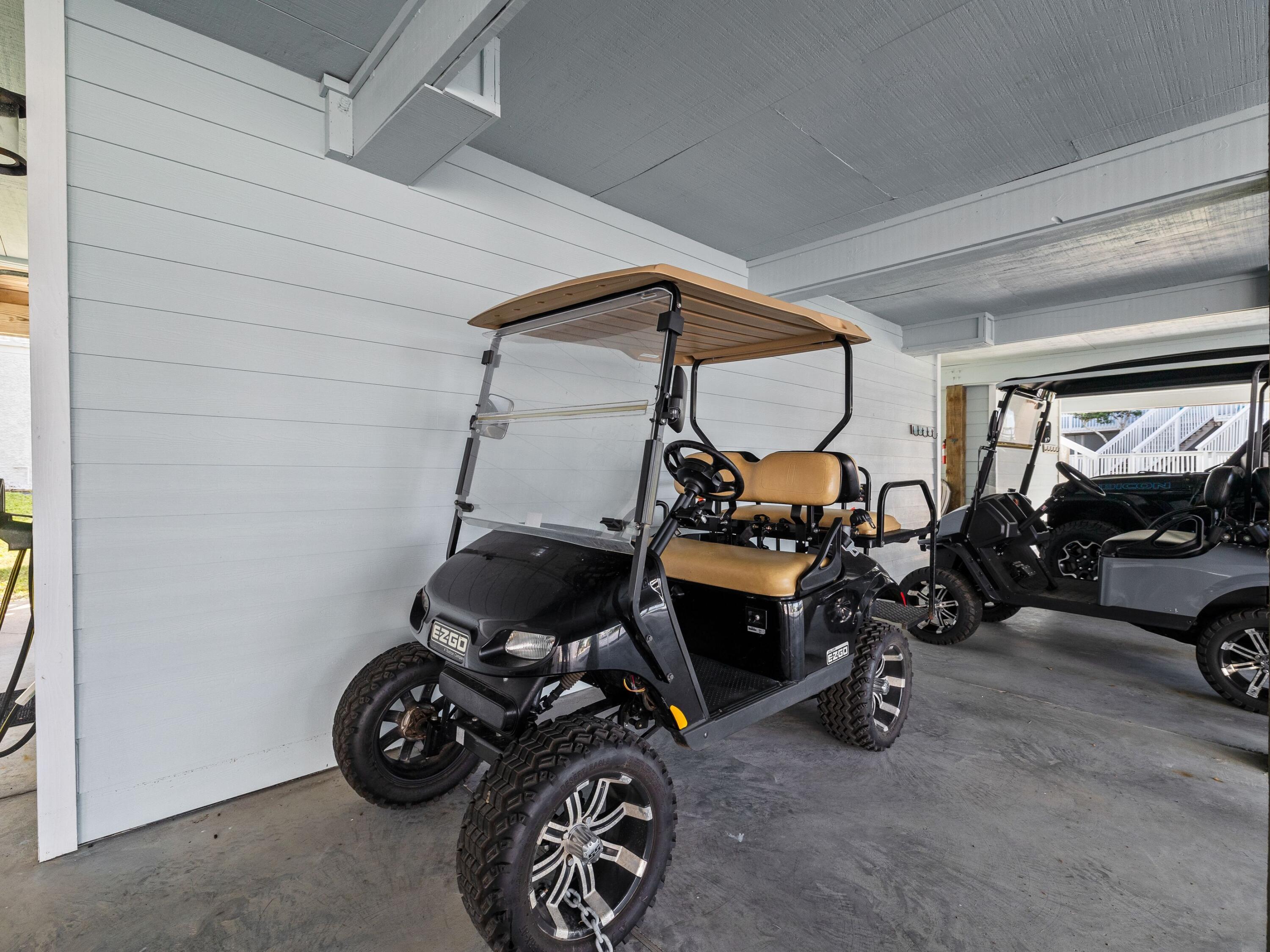 209 Blue Mountain Road, Unit 302 Santa Rosa Beach, FL 32459 - Photo 6 of 40 a view of a garage with a bike and a car