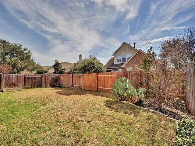 1832 Nelson Ranch Loop Cedar Park, TX 78613 - Photo 3 of 15 Securely fenced yard offers ample space for outdoor enjoyment and potential landscaping.