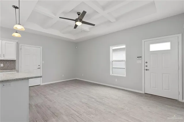 a view of an empty room with a window