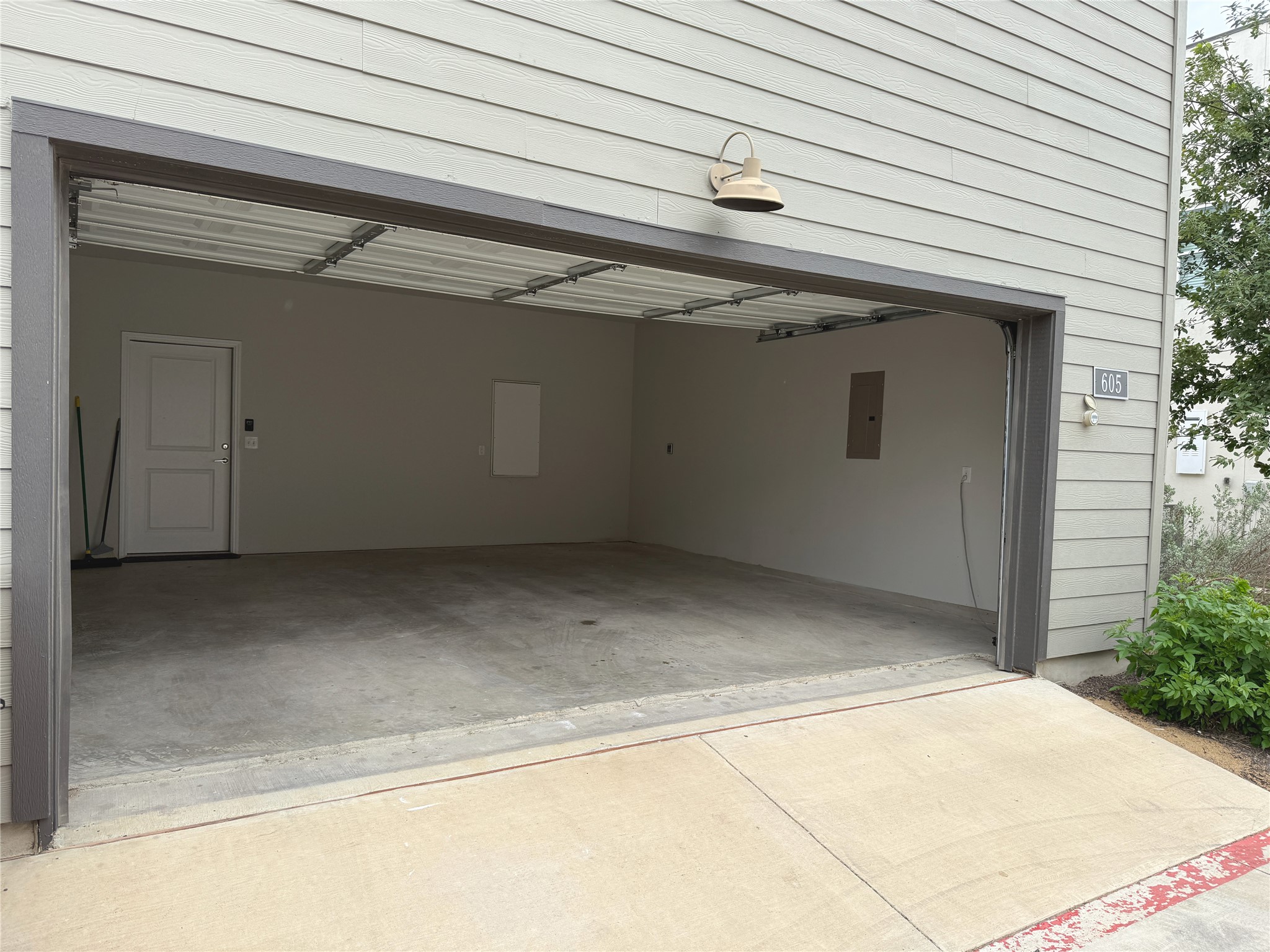 9015 Cattle Baron Path, Unit 605 Austin, TX 78747 - Photo 15 of 20 Garage featuring electric panel