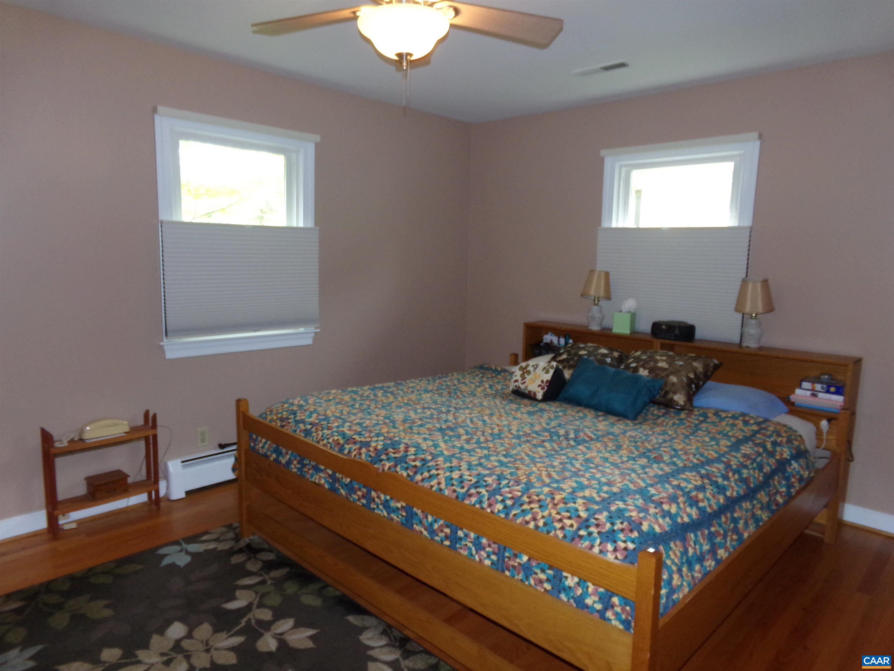 3011 Colonial Drive Charlottesville, VA 22911 - Photo 21 of 35 a bed sitting in a bedroom next to a window