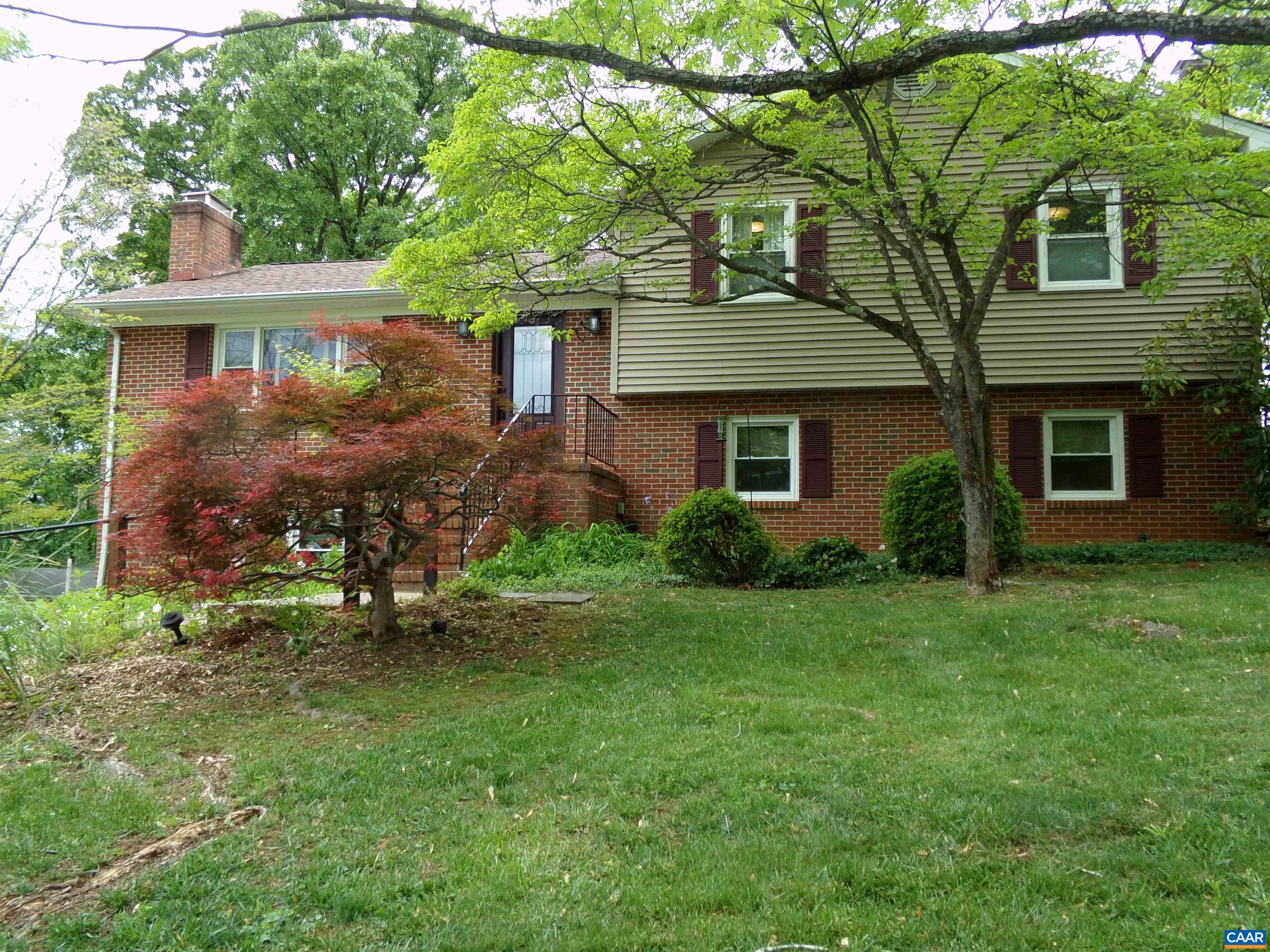 3011 Colonial Drive Charlottesville, VA 22911 - Photo 3 of 35 a front view of a house with a garden