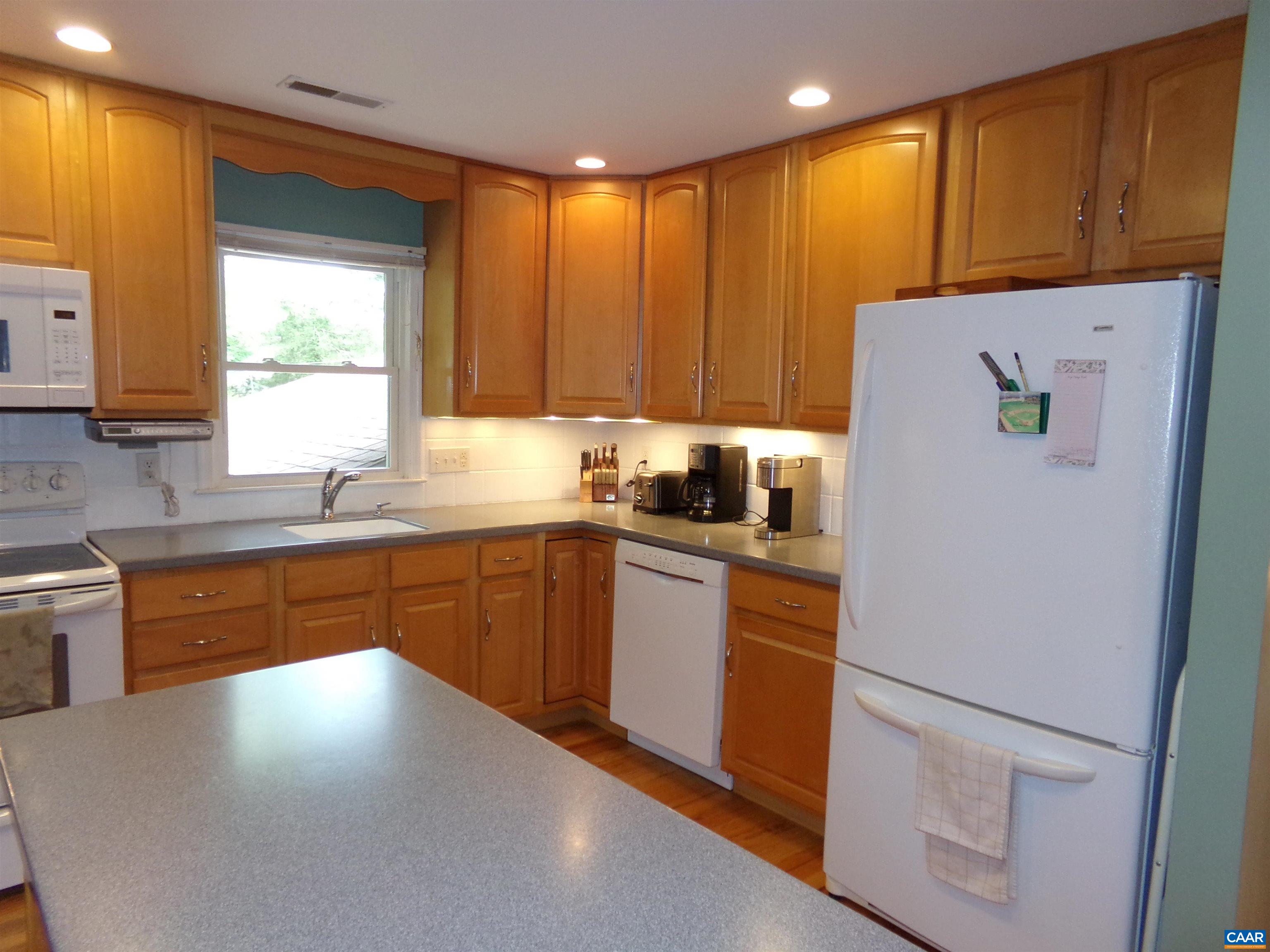 3011 Colonial Drive Charlottesville, VA 22911 - Photo 9 of 35 a kitchen with a refrigerator and a sink