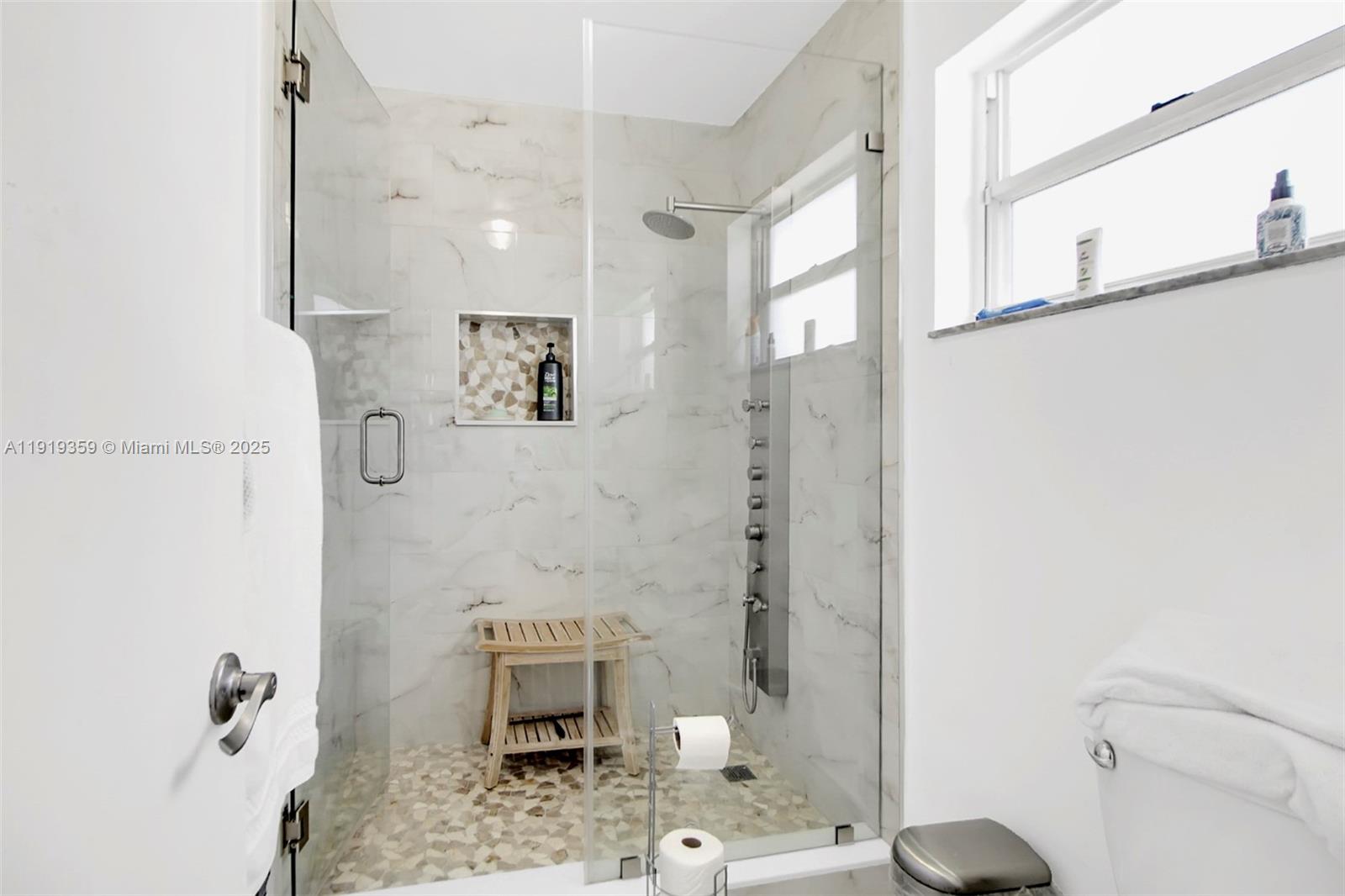 6122 Northwest 181st Terrace Circle West Hialeah, FL 33015 - Photo 13 of 28 a bathroom with a shower and a toilet