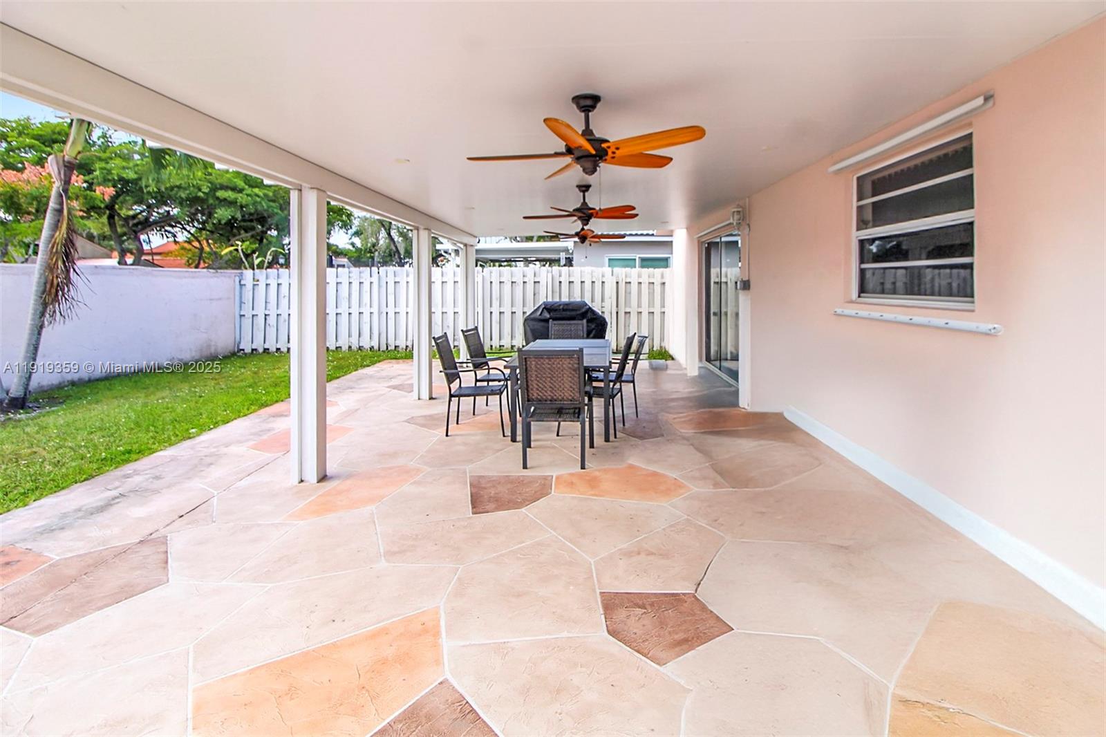 6122 Northwest 181st Terrace Circle West Hialeah, FL 33015 - Photo 19 of 28 a view of a patio with a table and chairs