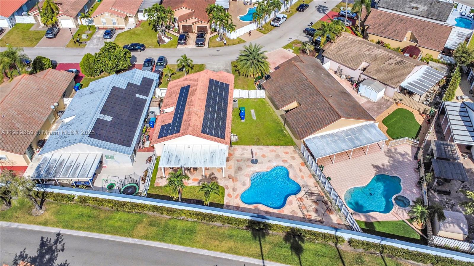 6122 Northwest 181st Terrace Circle West Hialeah, FL 33015 - Photo 26 of 28 an aerial view of house with yard swimming pool and outdoor seating