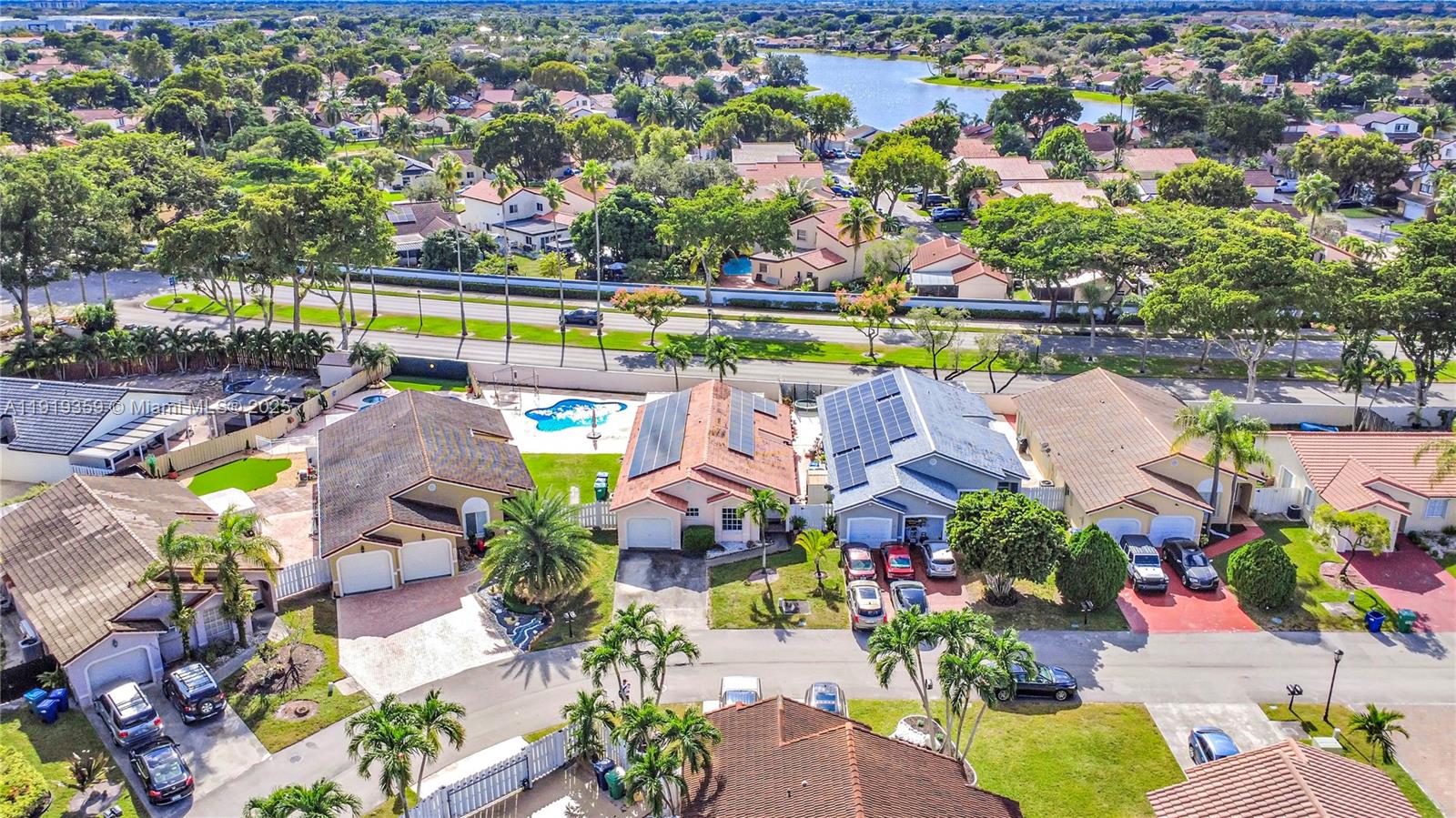6122 Northwest 181st Terrace Circle West Hialeah, FL 33015 - Photo 28 of 28 an aerial view of swimming pool patio and outdoor seating