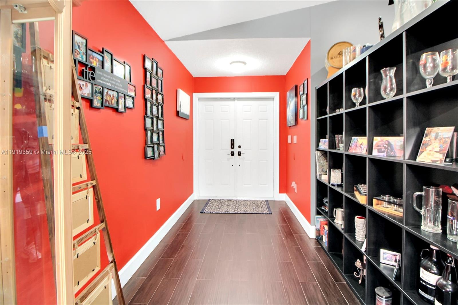 6122 Northwest 181st Terrace Circle West Hialeah, FL 33015 - Photo 4 of 28 a hallway with many windows