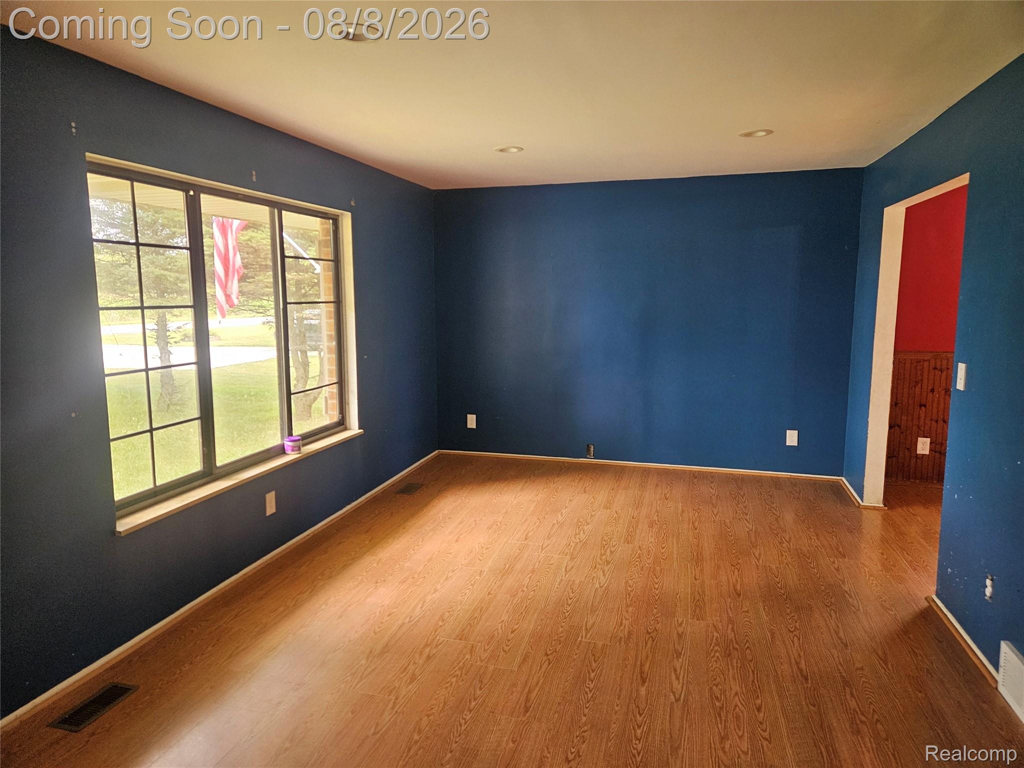 4507 West Wilson Road Clio, MI 48420 - Photo 2 of 14 Spacious interior room featuring wood-finish flooring, recessed ceiling lighting, and a large multi-pane window