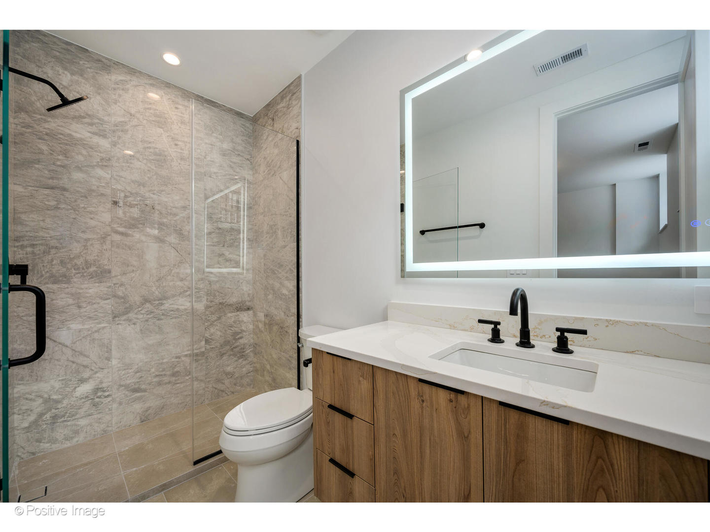 1124 West Addison Street Chicago, IL 60613 - Photo 14 of 42 a bathroom with a sink a toilet and shower