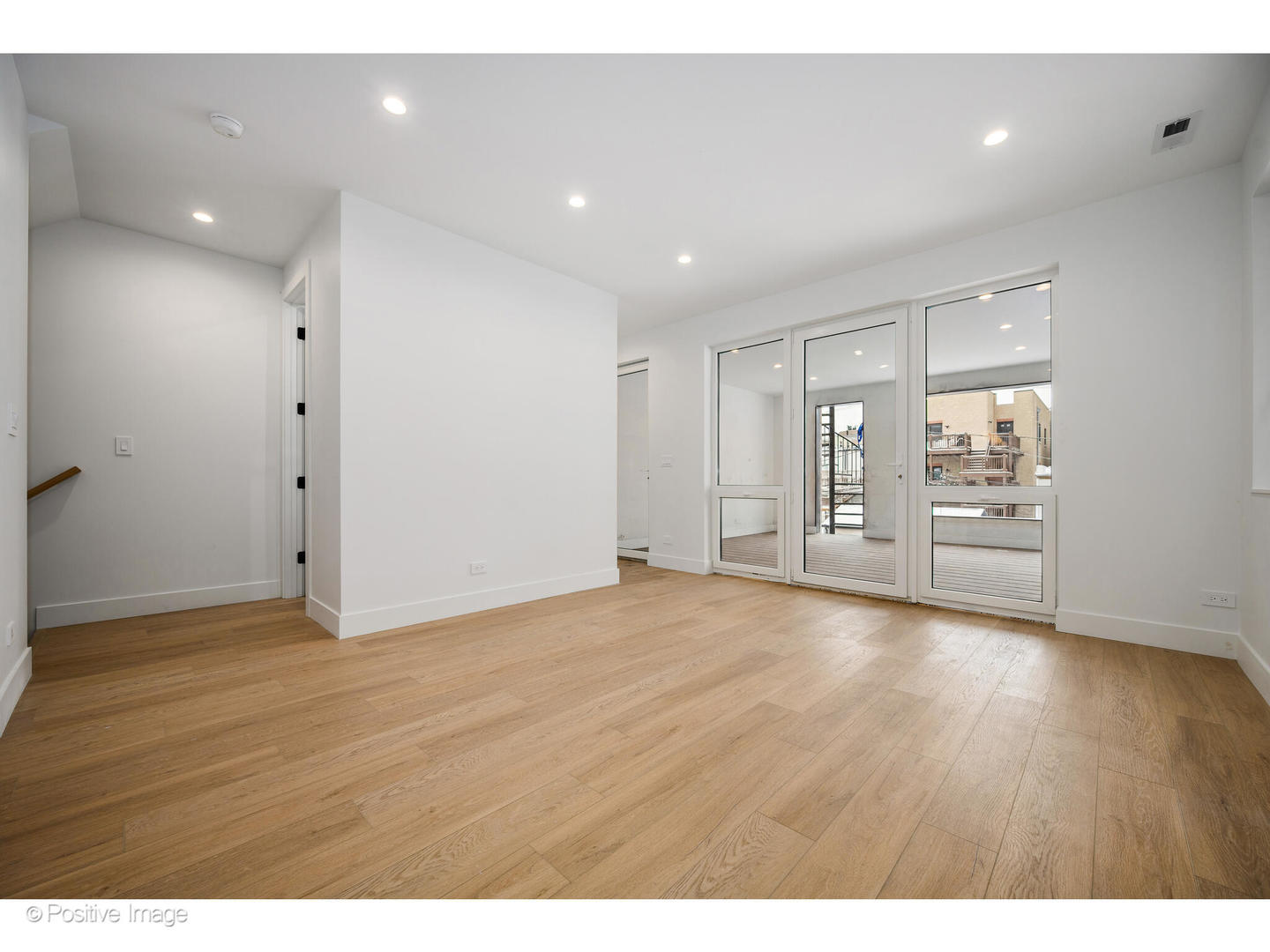 1124 West Addison Street Chicago, IL 60613 - Photo 21 of 42 a view of an empty room with wooden floor
