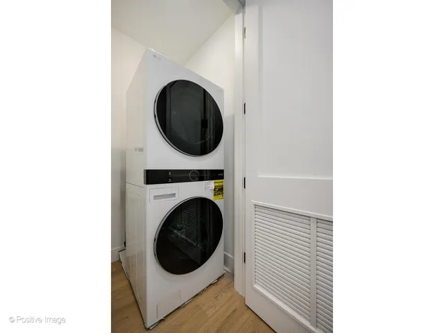 a view of a hallway with washer and dryer