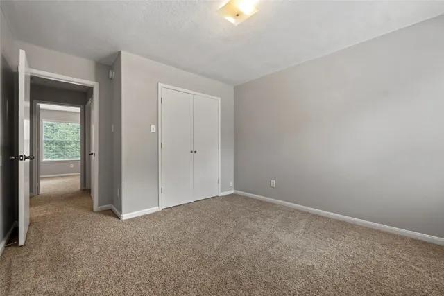 a view of an empty room and closet