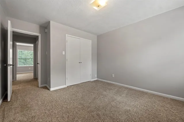 a view of an empty room and closet