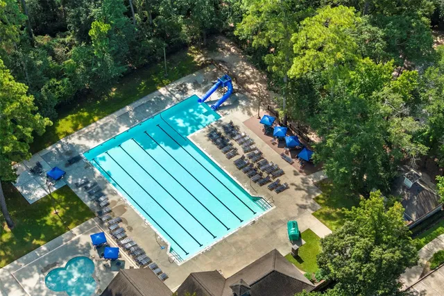 a view of a park with swings and slides