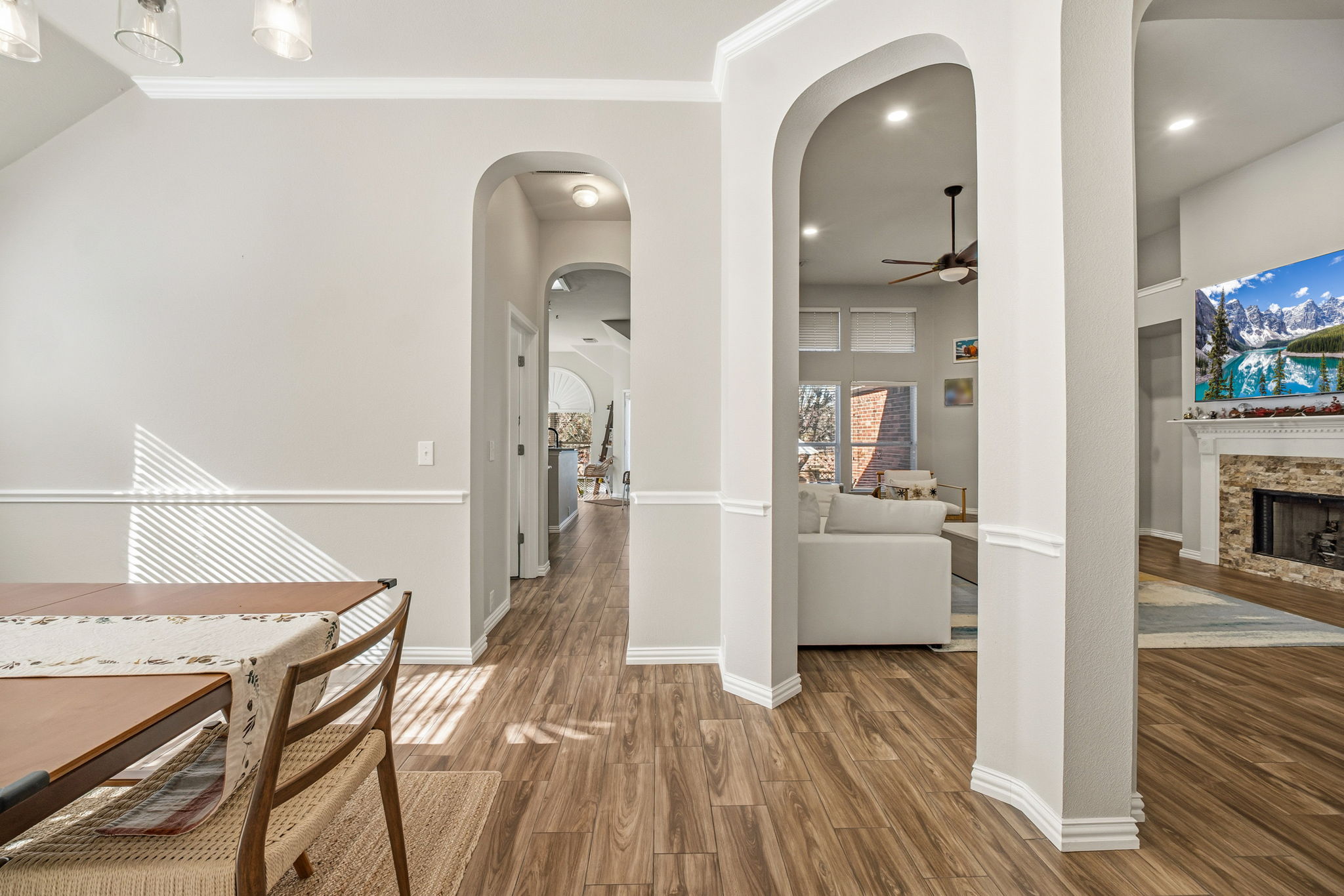 2112 Bandera Path Round Rock, TX 78665 - Photo 12 of 34 a view of a hallway with dining room and wooden floor