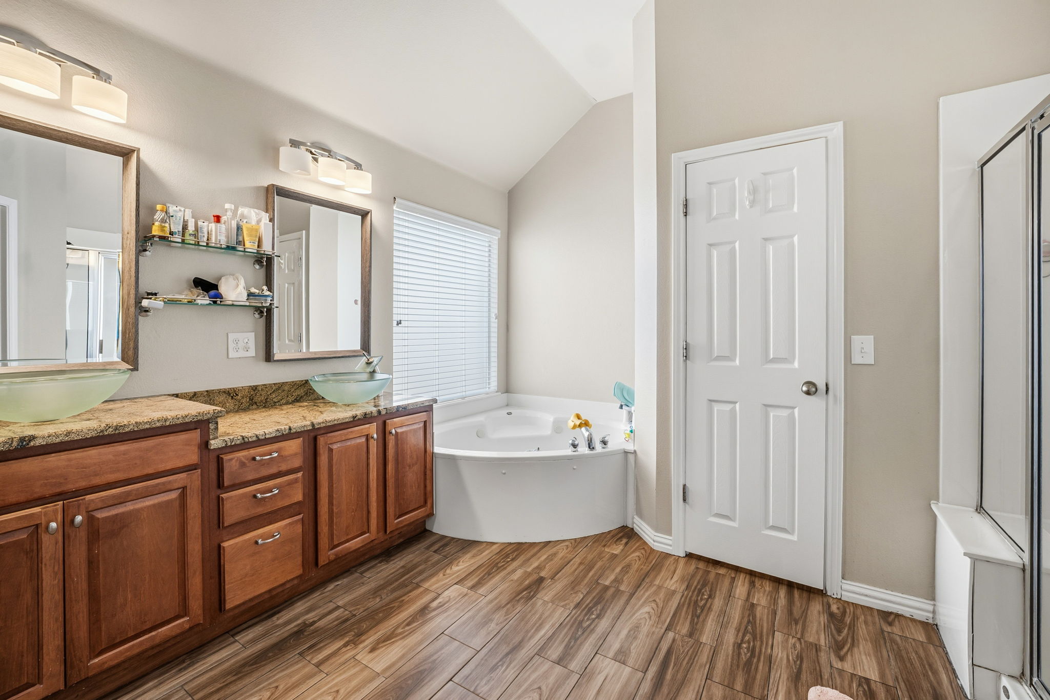 2112 Bandera Path Round Rock, TX 78665 - Photo 16 of 34 a spacious bathroom with a tub sink and mirror