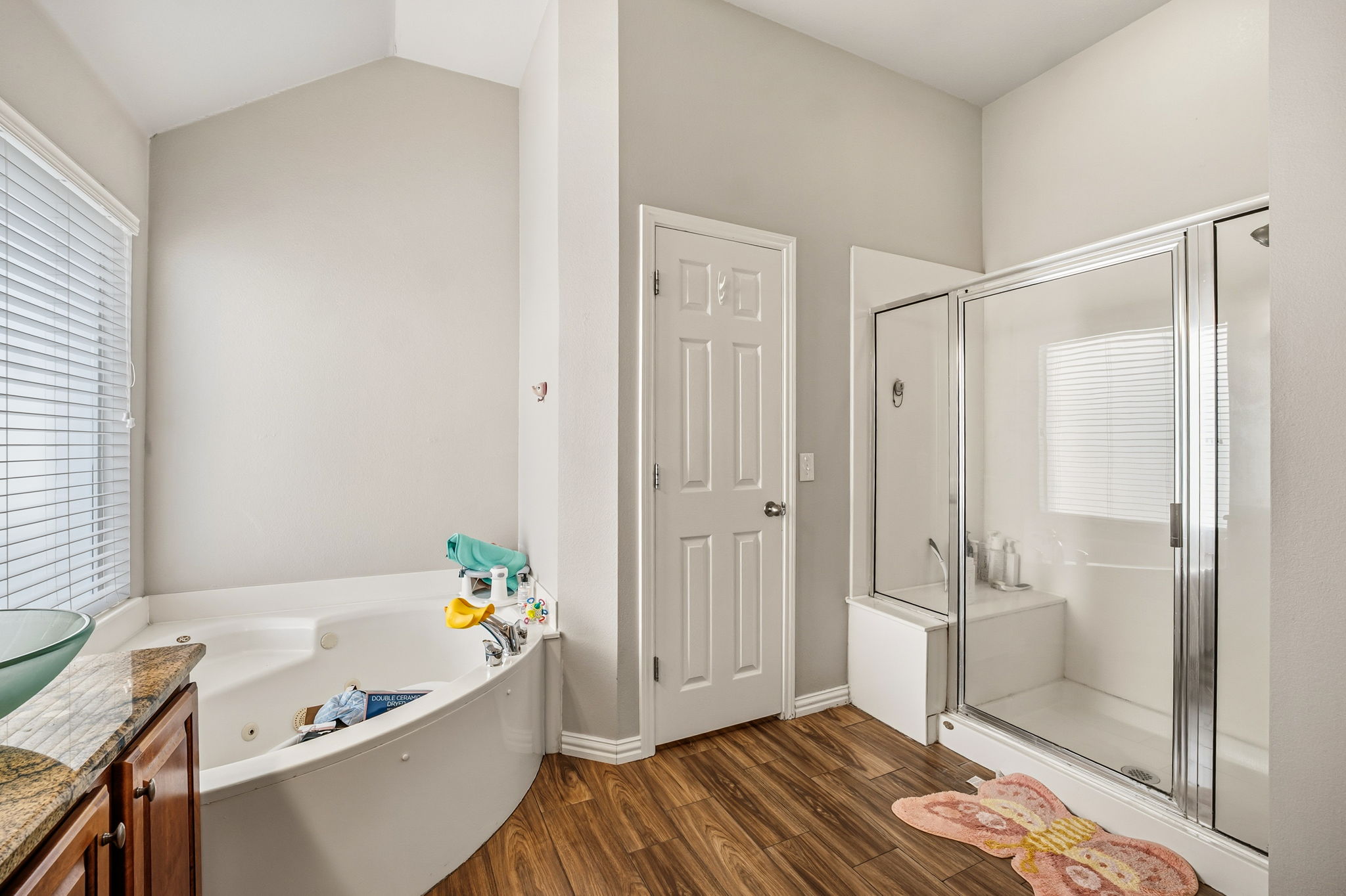 2112 Bandera Path Round Rock, TX 78665 - Photo 17 of 34 a bathroom with a bathtub and a shower
