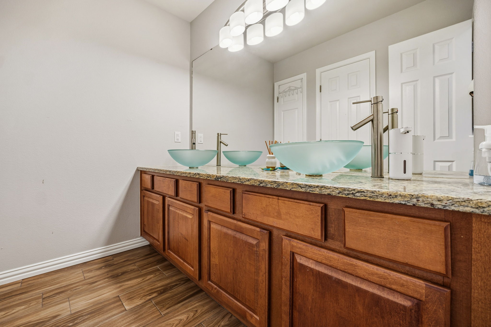 2112 Bandera Path Round Rock, TX 78665 - Photo 18 of 34 a kitchen with granite countertop white cabinets and a sink
